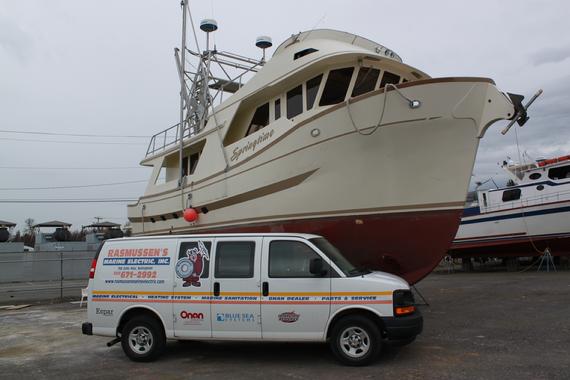 Rasmussen Marine Electric Van giving service to Luxury Boat
